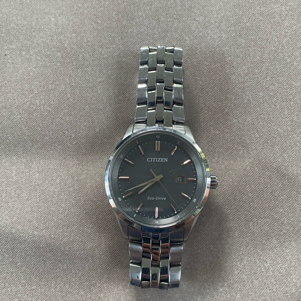 Silver Citizen eco drive watch.